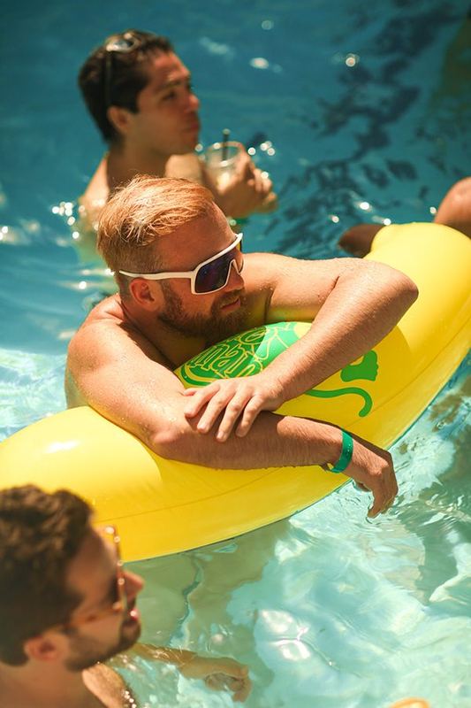 Pool party guest with float
