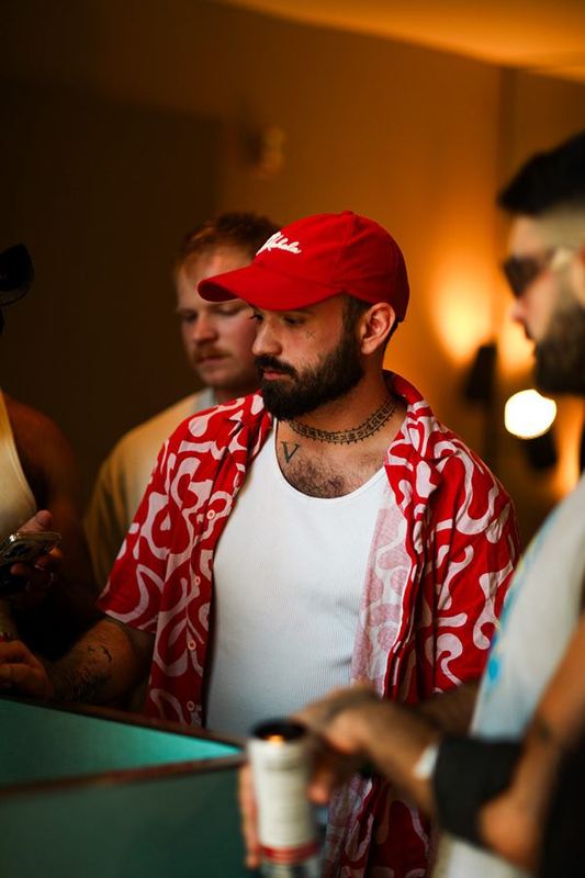 Guest in red printed shirt